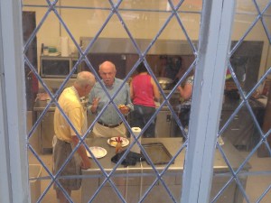 Church volunteers Bob Glidden, Frank Settle and Libby Cumming prepare breakfast